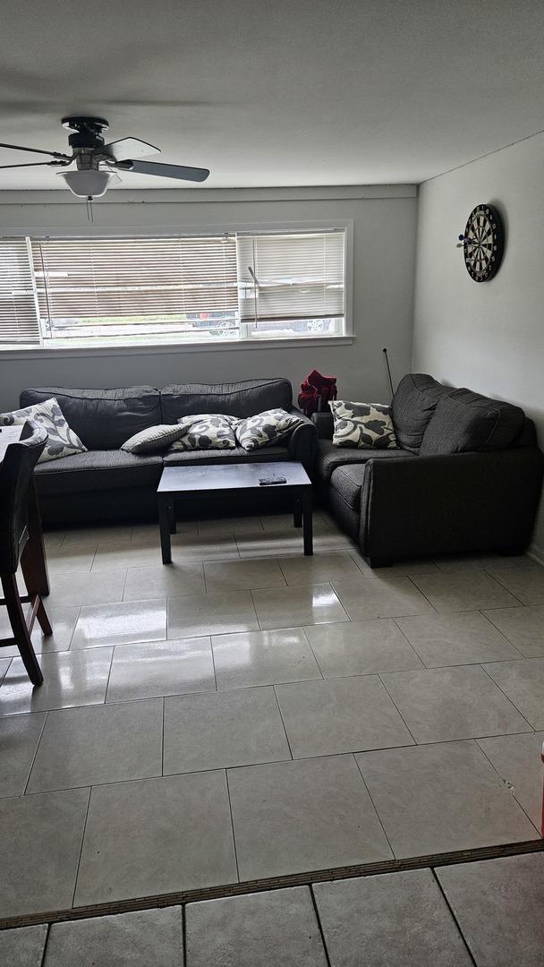 3201 Armitage Ave, Melrose Park, IL 60160 - living room with ceiling fan and tile patterned flooring