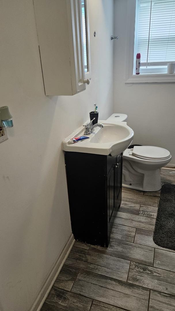 3201 Armitage Ave, Melrose Park, IL 60160 - bathroom with wood finished floors and vanity