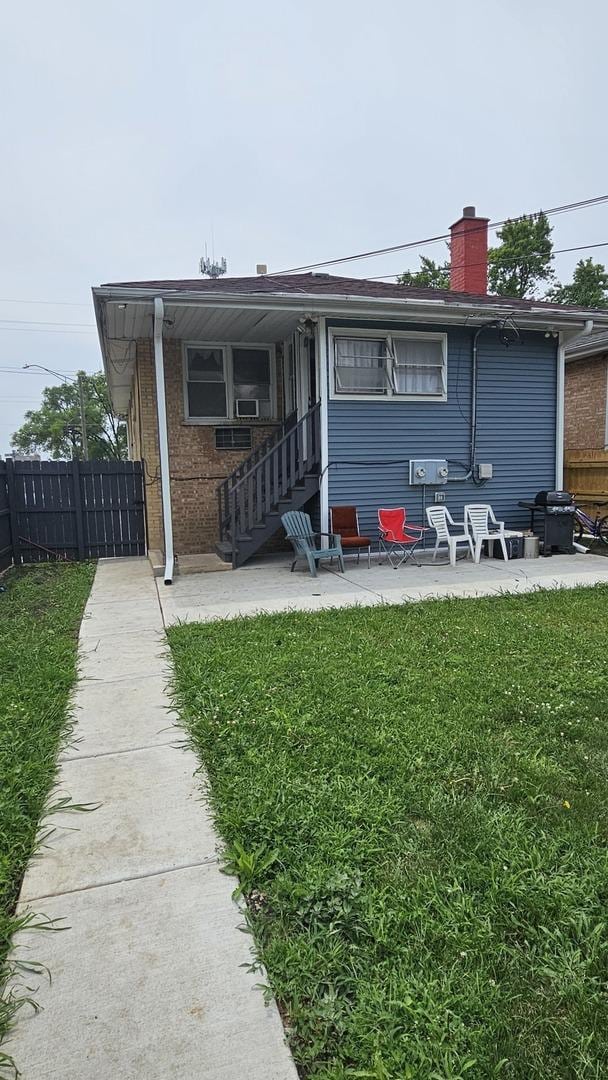 3201 Armitage Ave, Melrose Park, IL 60160 - rear view of property with a patio area and a chimney