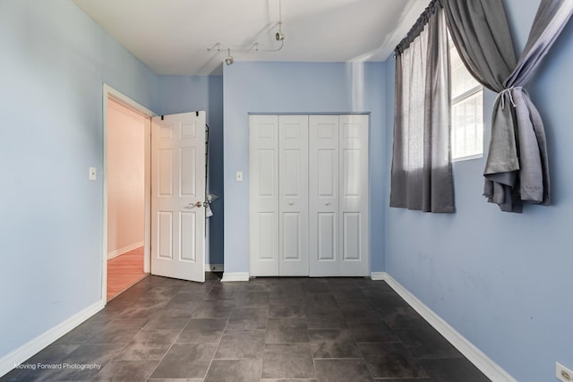 1423 E 68th St Unit 2, Chicago, IL 60637 - unfurnished bedroom with a closet and baseboards