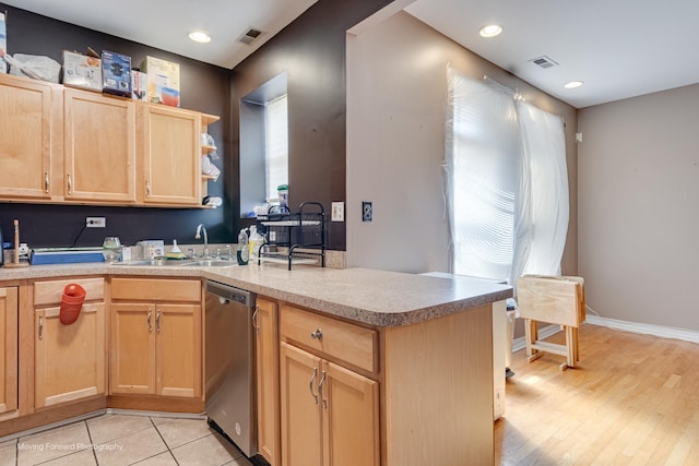 1423 E 68th St Unit 2, Chicago, IL 60637 - kitchen with stainless steel dishwasher, light brown cabinets, a peninsula, light countertops, and light wood-style flooring
