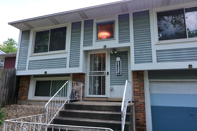 21546 Peterson Ave, Sauk Village, IL 60411 - view of front of house with brick siding and an attached garage