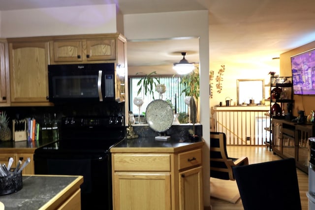 21546 Peterson Ave, Sauk Village, IL 60411 - kitchen with black appliances, dark countertops, and light brown cabinetry