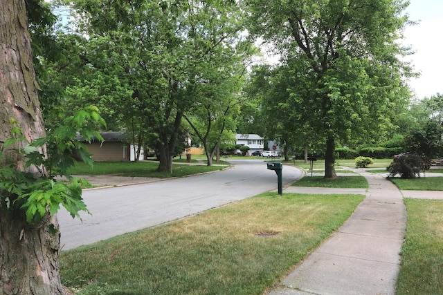 21546 Peterson Ave, Sauk Village, IL 60411 - view of asphalt street with sidewalks and curbs