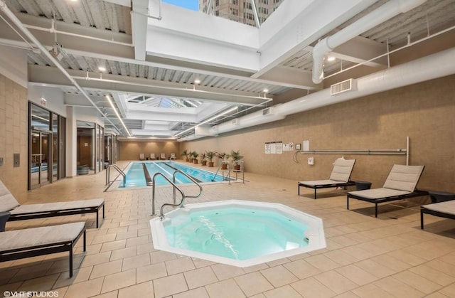 222 N Columbus Dr Unit 3702, Chicago, IL 60601 - indoor community pool featuring a skylight and a hot tub