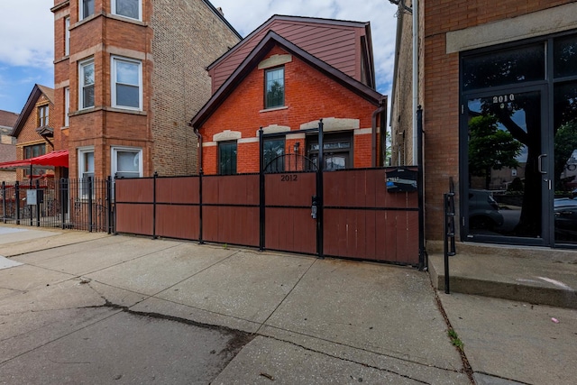 2012 W Coulter St, Chicago, IL 60608 - view of side of home featuring brick siding and a gate