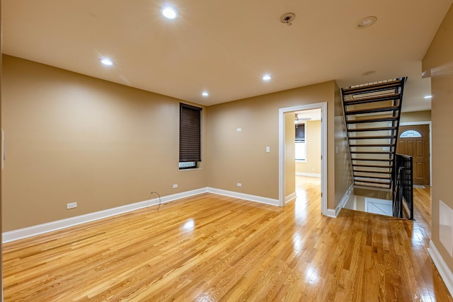 2012 W Coulter St, Chicago, IL 60608 - empty room with light wood-type flooring, recessed lighting, and stairs