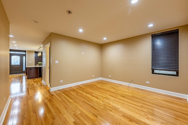 2012 W Coulter St, Chicago, IL 60608 - empty room with light wood-style floors and recessed lighting