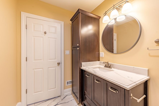 2012 W Coulter St, Chicago, IL 60608 - bathroom featuring marble look tile flooring and vanity