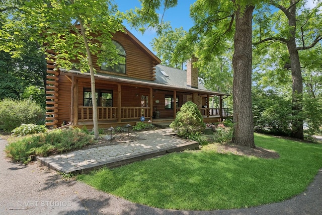 723 N River Rd, Algonquin, IL 60102 - view of front of house featuring log siding, a chimney, covered porch, and a front lawn