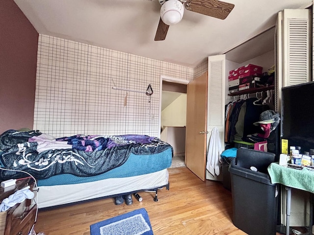 622 N Wisconsin Ave, Villa Park, IL 60181 - bedroom with a closet, wood finished floors, and ceiling fan