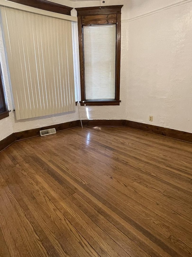 2724 W Flournoy St, Chicago, IL 60624 - spare room with dark wood-type flooring and baseboards