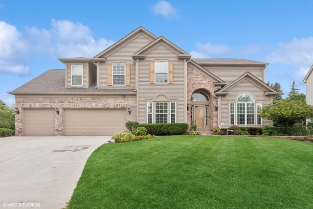 2701 Hamman Way, Aurora, IL 60502 - traditional home featuring driveway, a front lawn, brick siding, a shingled roof, and an attached garage