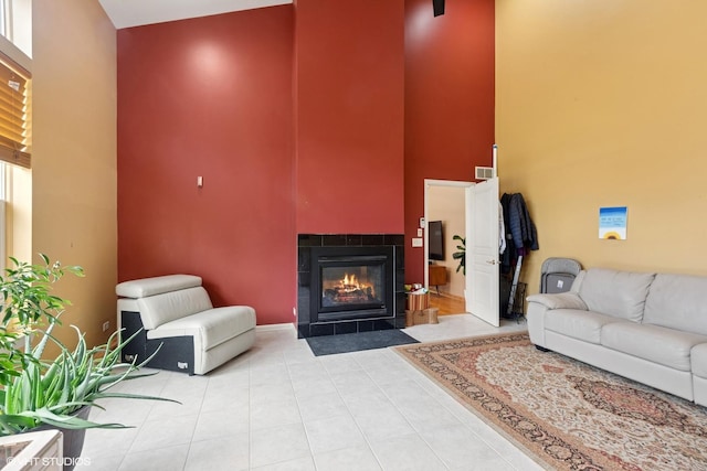 2701 Hamman Way, Aurora, IL 60502 - tiled living area featuring a towering ceiling and a tile fireplace