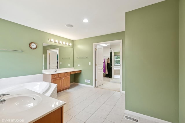 2701 Hamman Way, Aurora, IL 60502 - full bathroom with two vanities, tile patterned floors, a bath, and a walk in closet