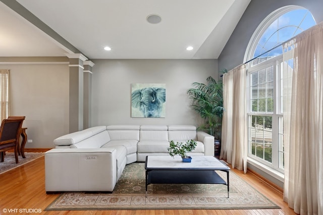 2701 Hamman Way, Aurora, IL 60502 - living room featuring ornate columns, light wood-style floors, recessed lighting, and lofted ceiling