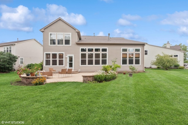 2701 Hamman Way, Aurora, IL 60502 - rear view of house with a patio and a lawn