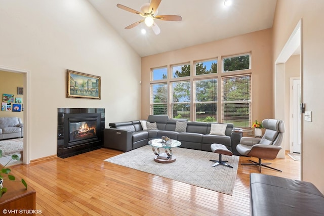2701 Hamman Way, Aurora, IL 60502 - living room featuring high vaulted ceiling, light wood finished floors, ceiling fan, and a fireplace