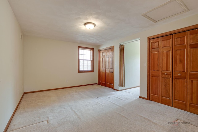 520 Holdridge Ave, Winthrop Harbor, IL 60096 - unfurnished bedroom featuring light carpet and two closets