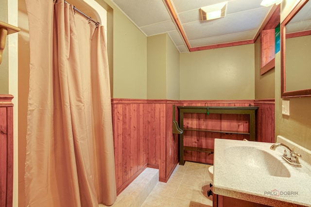 520 Holdridge Ave, Winthrop Harbor, IL 60096 - full bathroom with vanity, a wainscoted wall, tile patterned flooring, a shower with shower curtain, and wood walls
