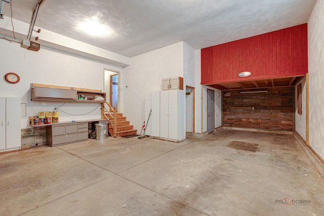 520 Holdridge Ave, Winthrop Harbor, IL 60096 - garage with wooden walls and a garage door opener