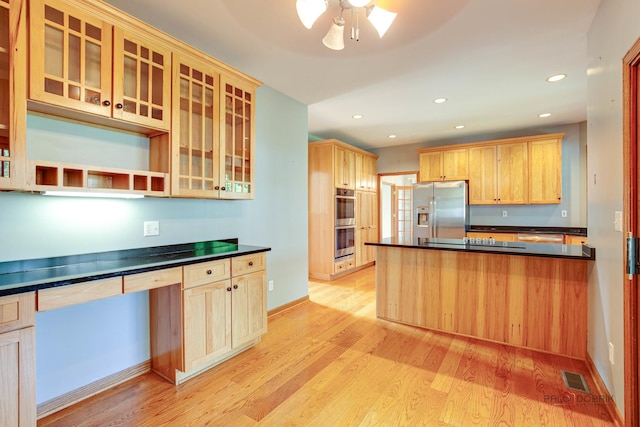 520 Holdridge Ave, Winthrop Harbor, IL 60096 - kitchen featuring dark countertops, stainless steel appliances, light brown cabinetry, light wood-type flooring, and recessed lighting