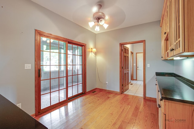 520 Holdridge Ave, Winthrop Harbor, IL 60096 - unfurnished dining area with a ceiling fan and light wood finished floors