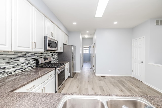 1114 Georgetown Way, Vernon Hills, IL 60061 - kitchen featuring appliances with stainless steel finishes, white cabinetry, backsplash, light wood-type flooring, and recessed lighting