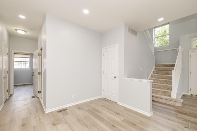 1114 Georgetown Way, Vernon Hills, IL 60061 - corridor with light wood-style flooring, stairs, plenty of natural light, and recessed lighting