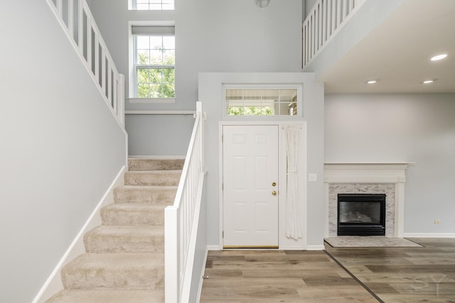 1114 Georgetown Way, Vernon Hills, IL 60061 - entrance foyer with stairway, wood finished floors, a premium fireplace, a towering ceiling, and recessed lighting