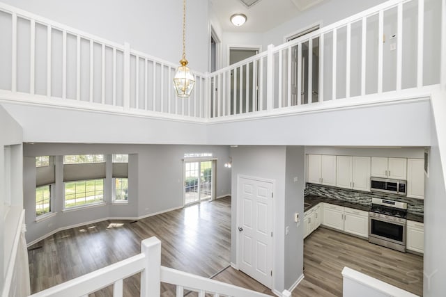 1114 Georgetown Way, Vernon Hills, IL 60061 - stairway with a high ceiling and wood finished floors