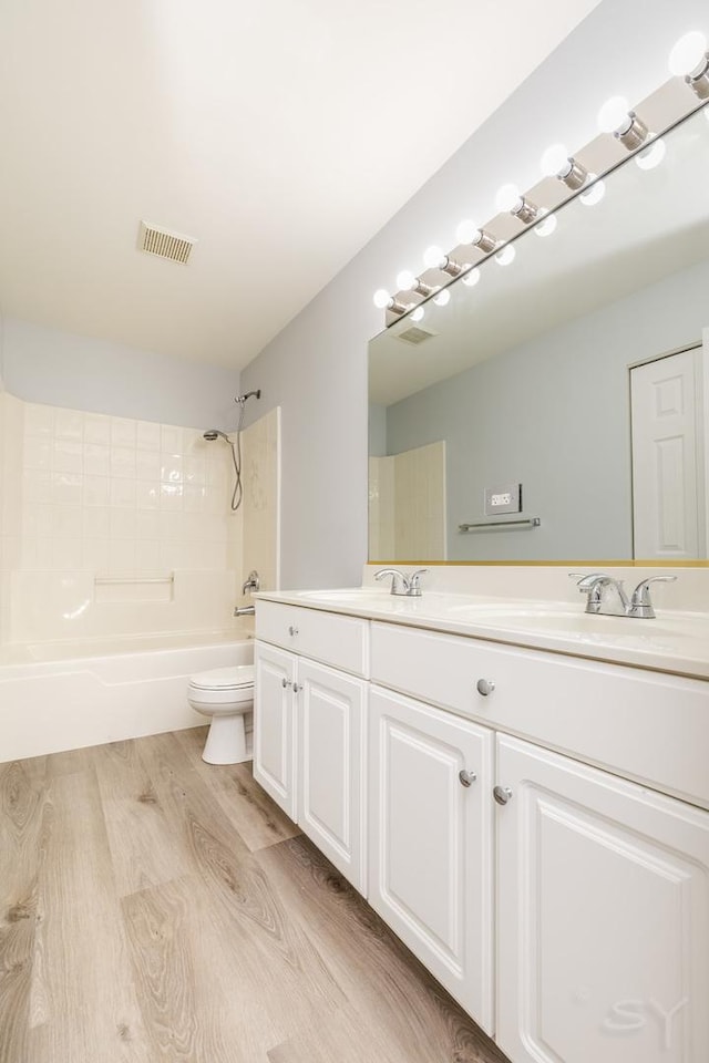 1114 Georgetown Way, Vernon Hills, IL 60061 - bathroom with double vanity, bathing tub / shower combination, and wood finished floors