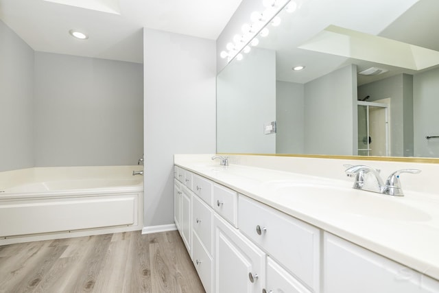 1114 Georgetown Way, Vernon Hills, IL 60061 - full bath with double vanity, a garden tub, wood finished floors, a shower with door, and recessed lighting