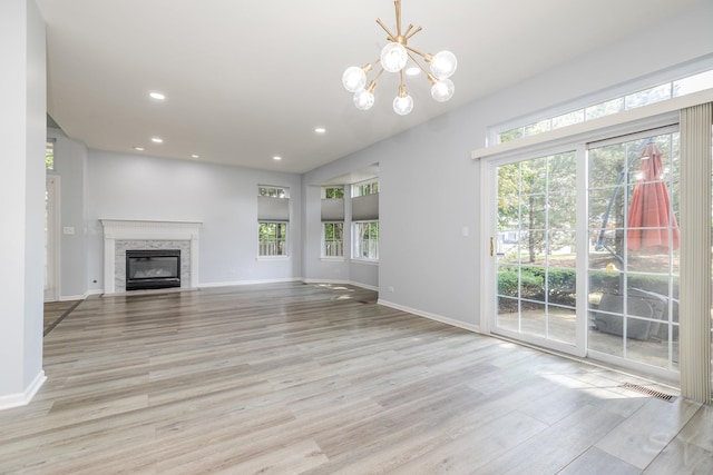 1114 Georgetown Way, Vernon Hills, IL 60061 - unfurnished living room featuring light wood finished floors, recessed lighting, a fireplace, and a chandelier