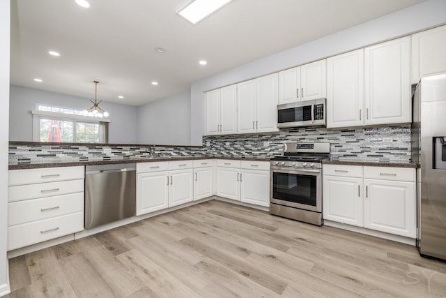 1114 Georgetown Way, Vernon Hills, IL 60061 - kitchen with stainless steel appliances, backsplash, white cabinetry, light wood-type flooring, and recessed lighting