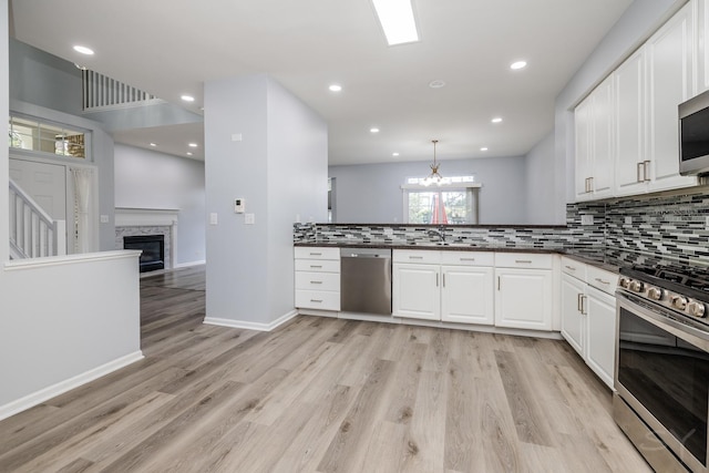 1114 Georgetown Way, Vernon Hills, IL 60061 - kitchen with stainless steel appliances, dark countertops, backsplash, white cabinetry, and recessed lighting