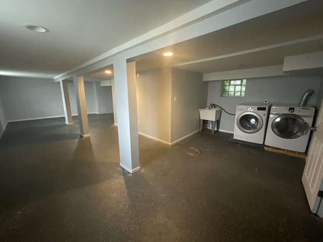 12200 S Lowe Ave, Chicago, IL 60628 - basement featuring washer and clothes dryer and baseboards