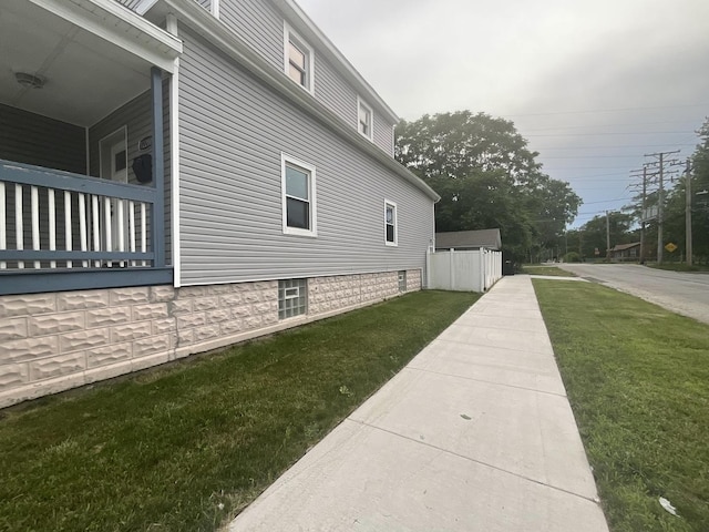 12200 S Lowe Ave, Chicago, IL 60628 - view of side of home with a yard
