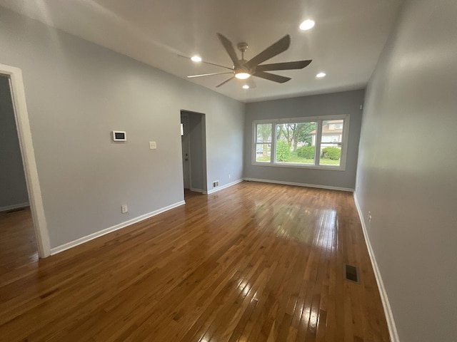 12200 S Lowe Ave, Chicago, IL 60628 - spare room with a ceiling fan, dark wood finished floors, and recessed lighting