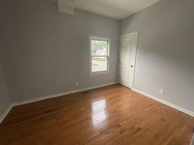 12200 S Lowe Ave, Chicago, IL 60628 - empty room with wood finished floors