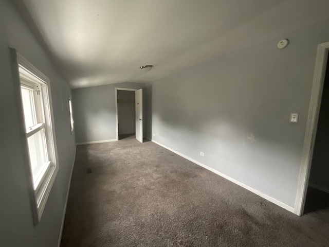 12200 S Lowe Ave, Chicago, IL 60628 - unfurnished room featuring lofted ceiling and carpet