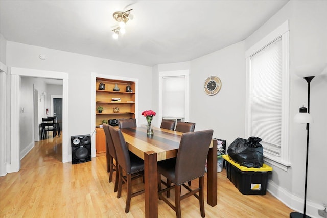 1637 N Keeler Ave, Chicago, IL 60639 - dining area with light wood-style floors and built in features