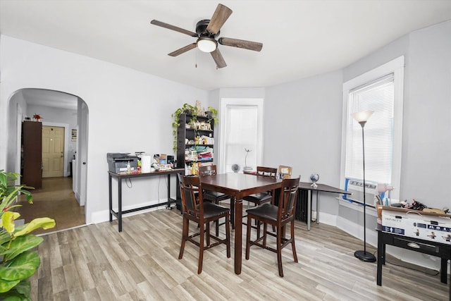 1637 N Keeler Ave, Chicago, IL 60639 - dining room with ceiling fan, arched walkways, and light wood-type flooring