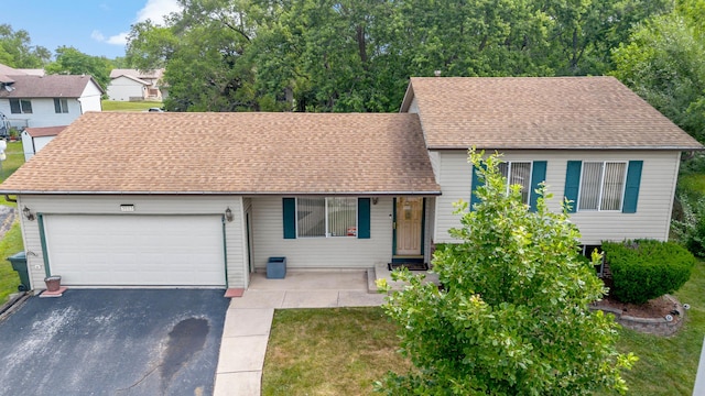 3513 Bordeaux Ct, Hazel Crest, IL 60429 - split level home featuring driveway, roof with shingles, a garage, and a front yard