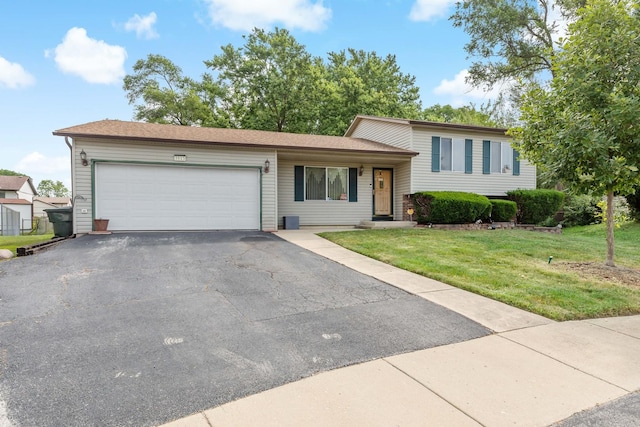 3513 Bordeaux Ct, Hazel Crest, IL 60429 - split level home featuring asphalt driveway, an attached garage, and a front lawn