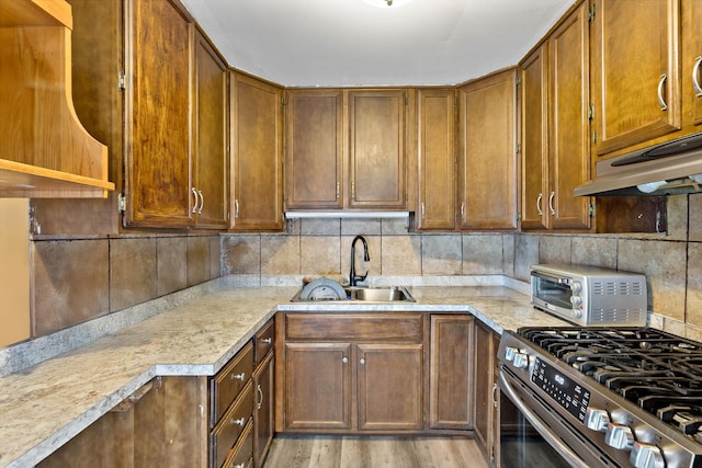 3513 Bordeaux Ct, Hazel Crest, IL 60429 - kitchen with stainless steel range with gas stovetop, light countertops, and tasteful backsplash