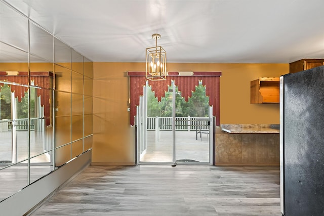 3513 Bordeaux Ct, Hazel Crest, IL 60429 - unfurnished dining area featuring wood finished floors and a chandelier