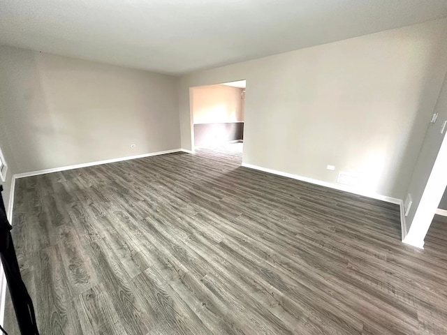 1734 Bishop Way, Mundelein, IL 60060 - spare room with dark wood-style floors and baseboards