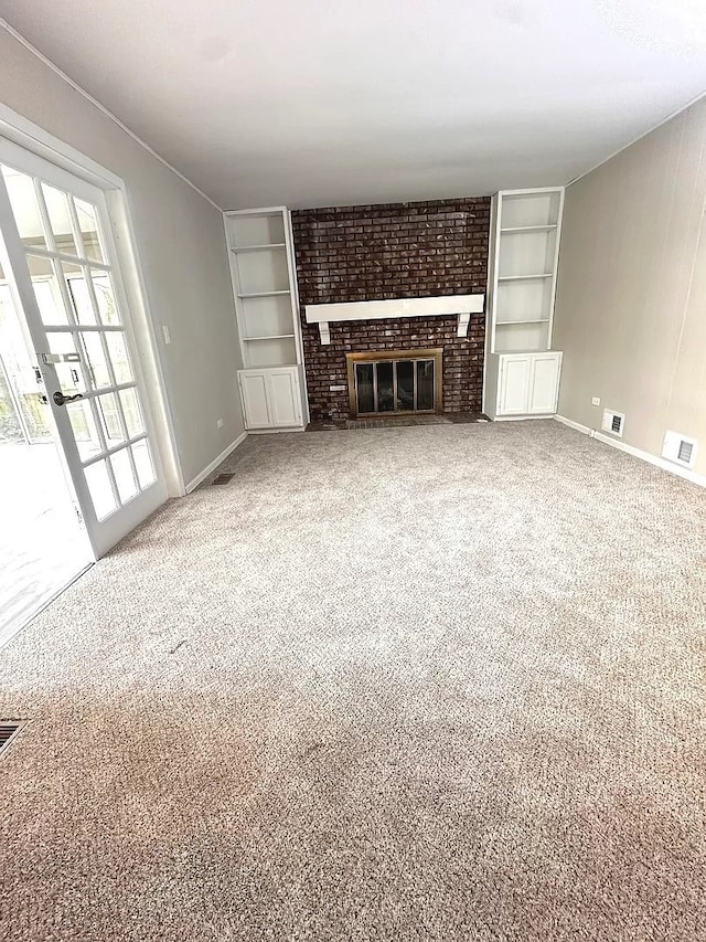 1734 Bishop Way, Mundelein, IL 60060 - unfurnished living room with built in features, carpet, and a brick fireplace