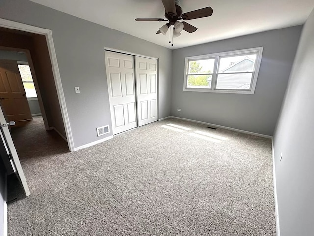 1734 Bishop Way, Mundelein, IL 60060 - unfurnished bedroom with carpet floors, a closet, and a ceiling fan